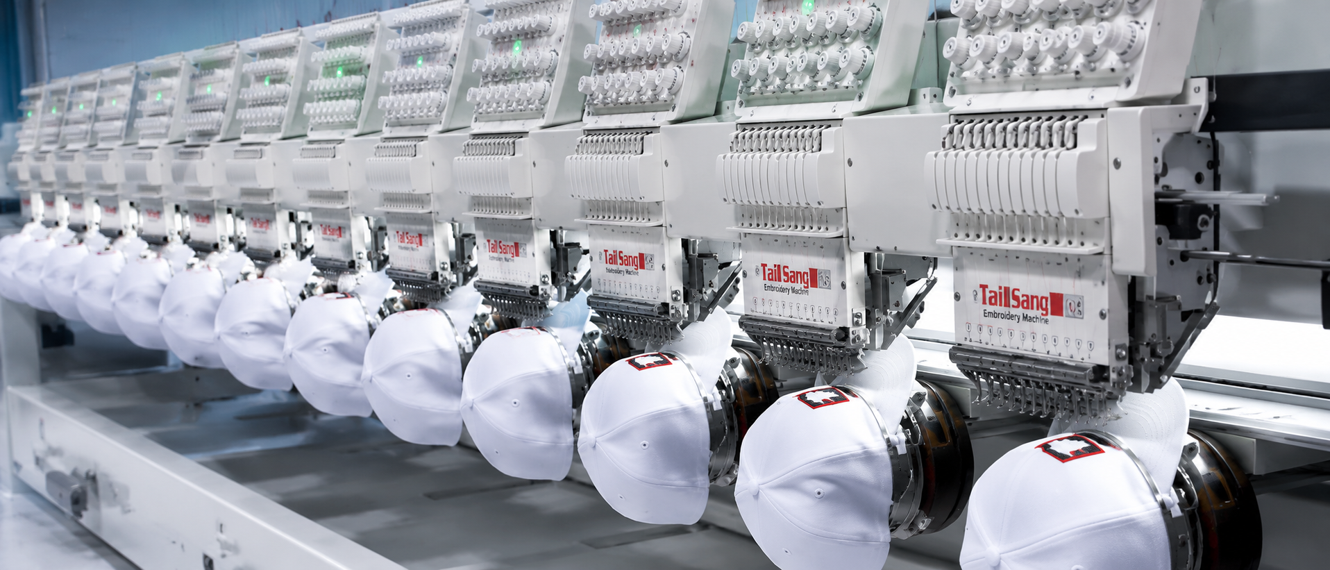 Multi-head industrial embroidery machine line at Elegant Uniforms